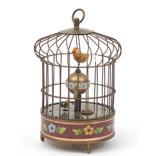 2437 - Brass and cloisonne clockwork automaton bird cage with alarm clock, 20cm high