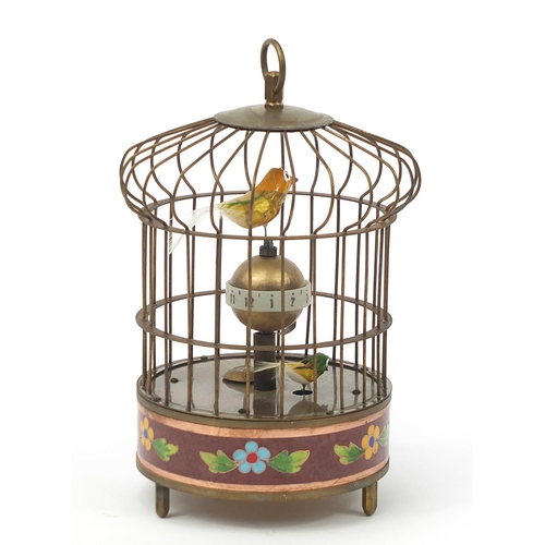 2437 - Brass and cloisonne clockwork automaton bird cage with alarm clock, 20cm high