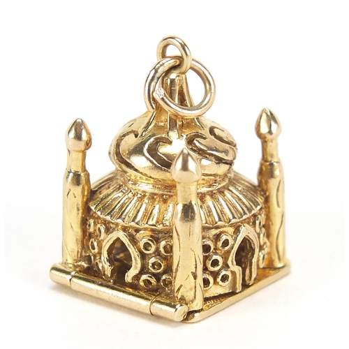 48 - 9ct gold and enamel Taj Mahal charm opening to reveal a praying figure, 2.2cm high, 10.2g