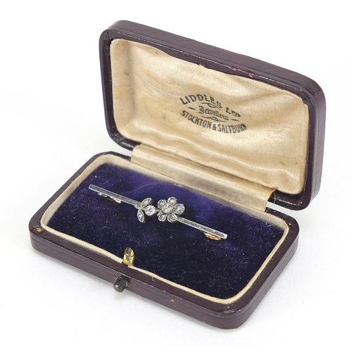 117 - 15ct gold and platinum diamond flower bar brooch, housed in a Liddles Ltd jeweller's box, 4.2cm in l... 