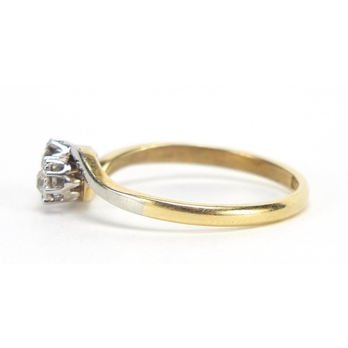 192 - 18ct gold and platinum diamond crossover ring, the diamonds approximately 2.5mm in diameter, size O,... 