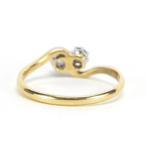 192 - 18ct gold and platinum diamond crossover ring, the diamonds approximately 2.5mm in diameter, size O,... 