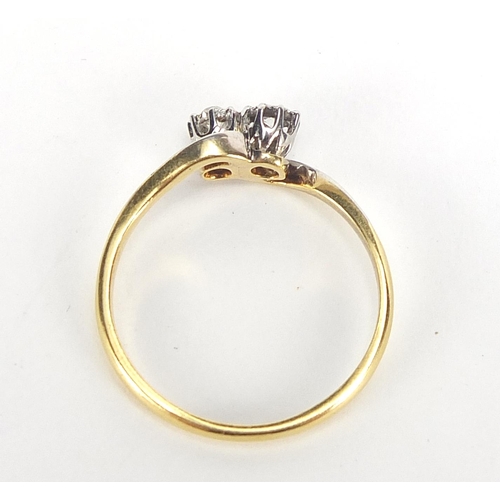 192 - 18ct gold and platinum diamond crossover ring, the diamonds approximately 2.5mm in diameter, size O,... 