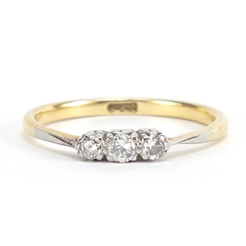 169 - 18ct gold diamond three stone ring, size R, 2.8g