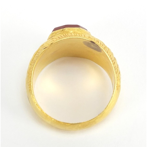 16 - Antique unmarked gold intaglio seal ring carved with a horse, (tests as 15ct+) size U, 5.6g