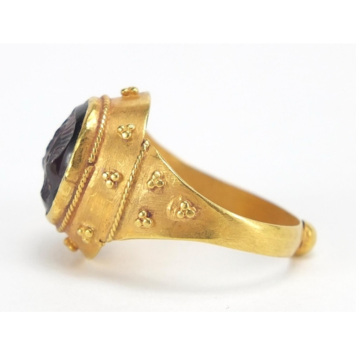29 - Antique unmarked gold intaglio silver ring carved with a gladiator head, (tests as 15ct+) size M, 5.... 
