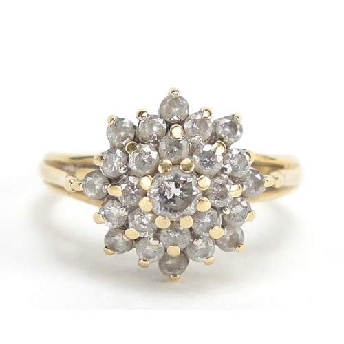 188 - Unmarked gold diamond four tier cluster ring, approximately 1.00 carat in total, size K, 4.2g