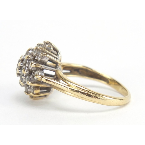 188 - Unmarked gold diamond four tier cluster ring, approximately 1.00 carat in total, size K, 4.2g