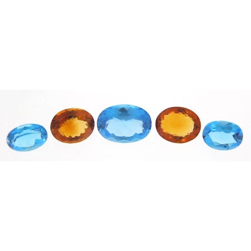 100 - Five gem stones comprising three blue sapphires and two citrine, the largest 18mm x 13mm x 8.5mm dee... 