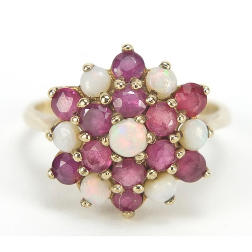 398 - 9ct gold opal and ruby three tier cluster ring, size O, 3.6g