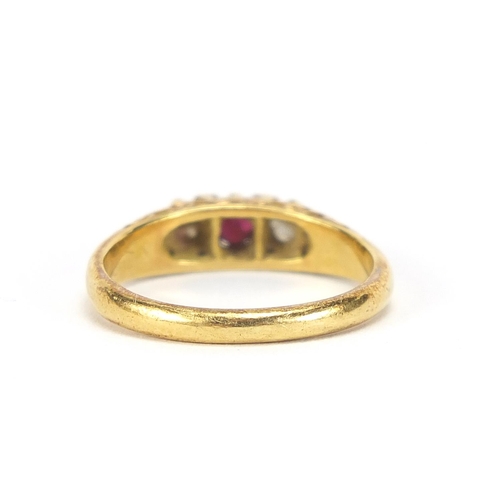 428 - 18ct gold diamond and ruby three stone ring, size M, 3.8g