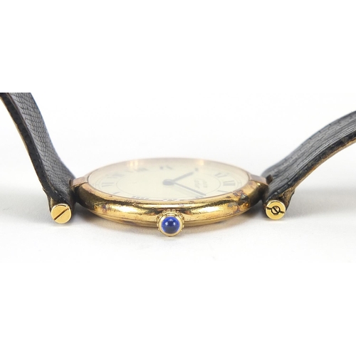 194 - Must de Cartier, gentlemen's silver gilt Vermeil quartz wristwatch with cabochon sapphire crown, the... 