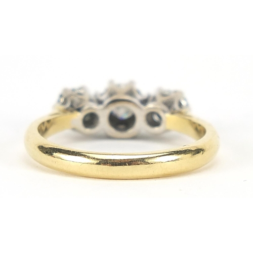 313 - 18ct gold diamond three stone ring, the central diamond approximately 3mm in diameter, size L, 3.8g