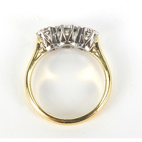 313 - 18ct gold diamond three stone ring, the central diamond approximately 3mm in diameter, size L, 3.8g