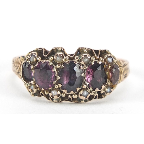 331 - Victorian 9ct gold amethyst and seed pearl ring with ornate setting and chased band, housed in an M.... 