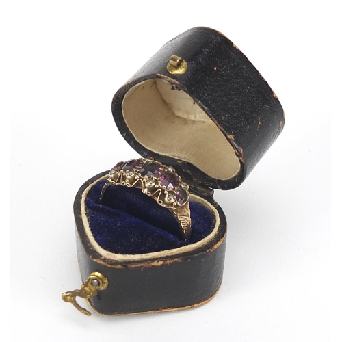 331 - Victorian 9ct gold amethyst and seed pearl ring with ornate setting and chased band, housed in an M.... 