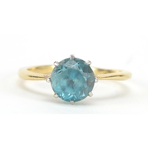 402 - 18ct gold blue stone solitaire ring, possibly aquamarine, size L, 3.2g