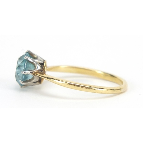 402 - 18ct gold blue stone solitaire ring, possibly aquamarine, size L, 3.2g