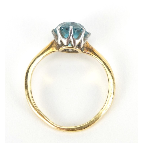 402 - 18ct gold blue stone solitaire ring, possibly aquamarine, size L, 3.2g