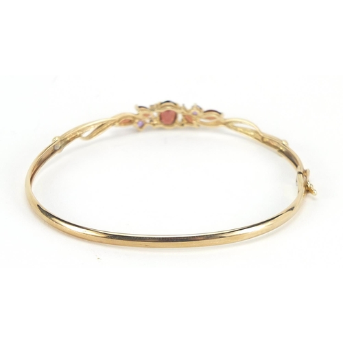 379 - 9ct gold diamond and multi gem hinged bangle, 6cm in diameter, 4.0g