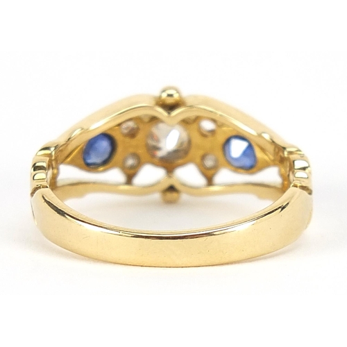 88 - Edwardian 18ct gold diamond and sapphire ring with pierced ornate setting, the central diamond appro... 