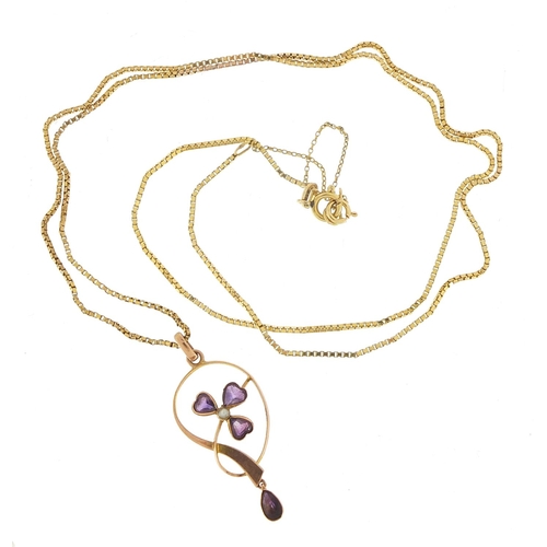 424 - Art Nouveau 9ct gold amethyst and seed pearl pendant on a 9ct gold necklace, 4cm high and 60cm in le... 