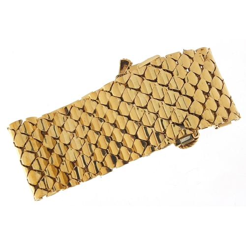 11 - Large 9ct gold belt and buckle design bracelet with floral basket design clasp, S & SLD maker's mark... 