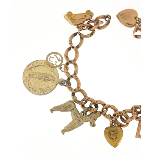 340 - 9ct rose gold charm bracelet with a selection of gold and metal charms including love heart padlock,... 