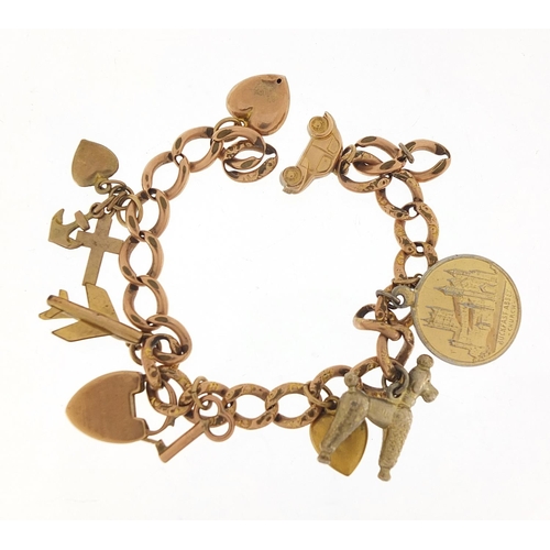 340 - 9ct rose gold charm bracelet with a selection of gold and metal charms including love heart padlock,... 