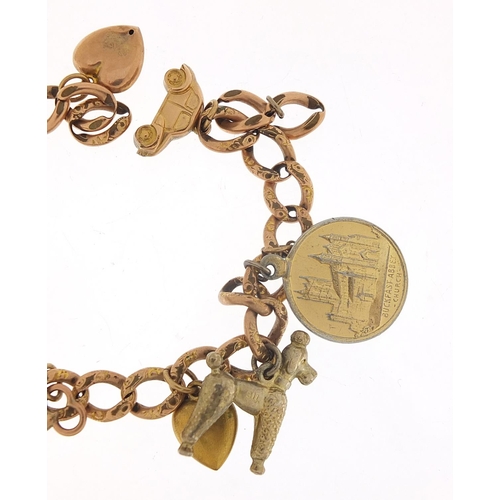 340 - 9ct rose gold charm bracelet with a selection of gold and metal charms including love heart padlock,... 