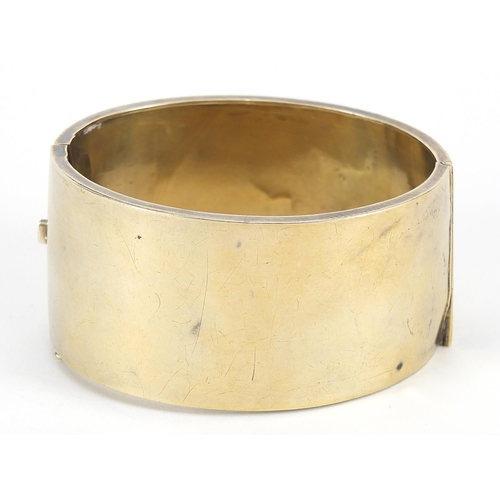 242 - Victorian aesthetic silver gilt hinged bangle engraved with birds amongst bamboo, Birmingham 1886, 6... 