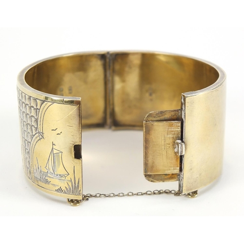 242 - Victorian aesthetic silver gilt hinged bangle engraved with birds amongst bamboo, Birmingham 1886, 6... 