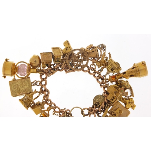 151 - Good 9ct gold charm bracelet with a large selection of mostly gold charms including agate love heart... 