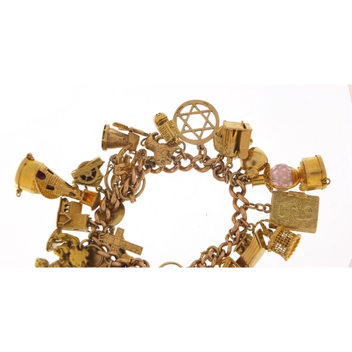 151 - Good 9ct gold charm bracelet with a large selection of mostly gold charms including agate love heart... 