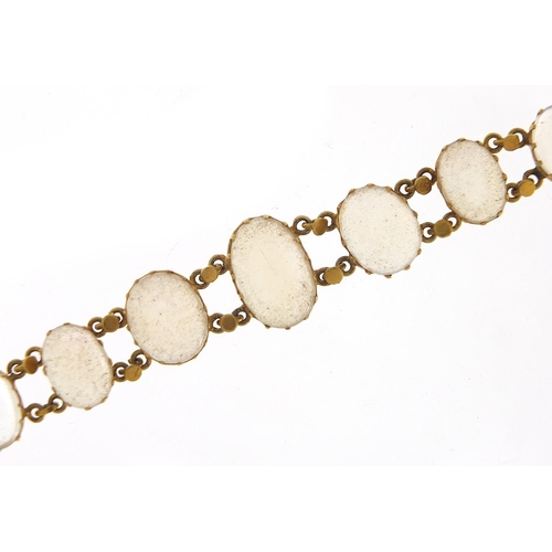 15 - Antique unmarked gold graduated cabochon moonstone bracelet, 13cm in length, 7.6g