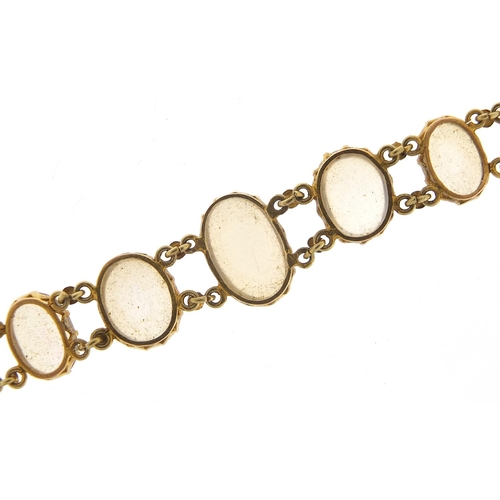 15 - Antique unmarked gold graduated cabochon moonstone bracelet, 13cm in length, 7.6g