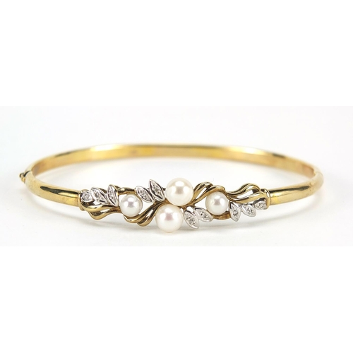 61 - 9ct gold pearl and diamond hinged bangle, 6.5cm wide, 7.0g