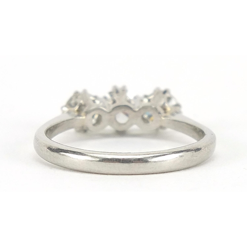 73 - White gold diamond three stone ring, the central diamond approximately 4.5mm in diameter, indistinct... 