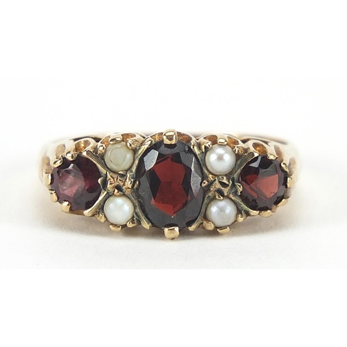 274 - Victorian design 9ct gold garnet and pearl ring, size Q, 3.6g