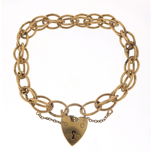 355 - 9ct gold charm bracelet with love heart padlock, 20cm in length, 24.0g