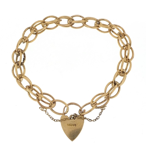 355 - 9ct gold charm bracelet with love heart padlock, 20cm in length, 24.0g