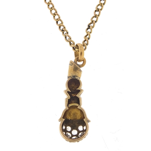 270 - Unmarked gold white sapphire pendant on a 9ct gold necklace, 2.5cm high and 40cm in length, the neck... 