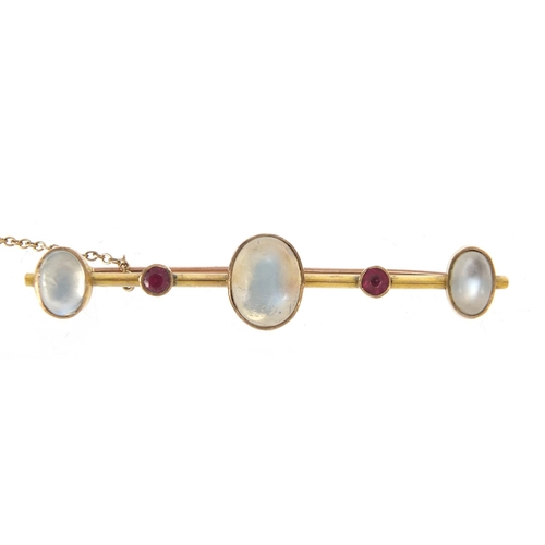 63 - Unmarked gold cabochon moonstone and ruby bar brooch, 5.5cm wide, 5.7g