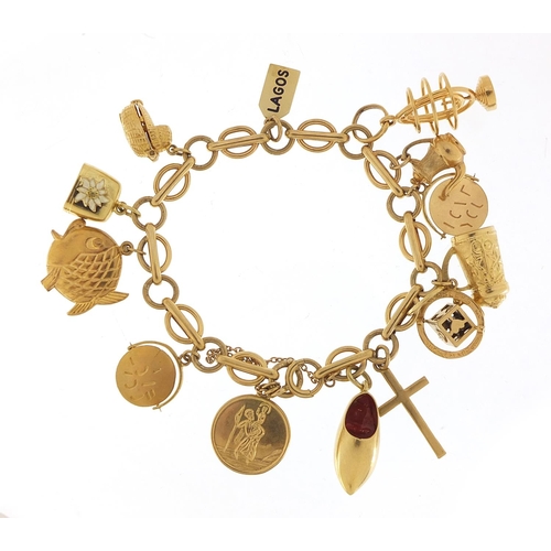 40 - 9ct gold charm bracelet with a selection of mostly gold charms including St Christopher, Dutch clog ... 