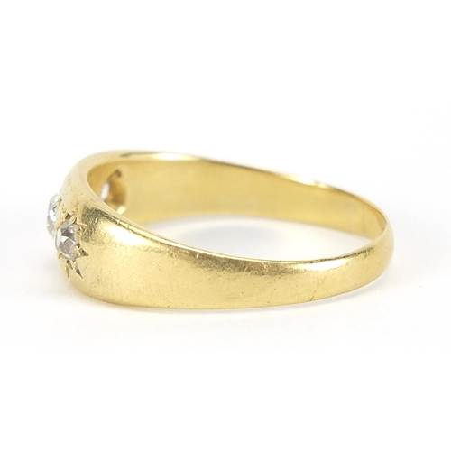 1 - 18ct gold diamond three stone Gypsy ring, the center diamond approximately 3.5mm in diameter, size U... 