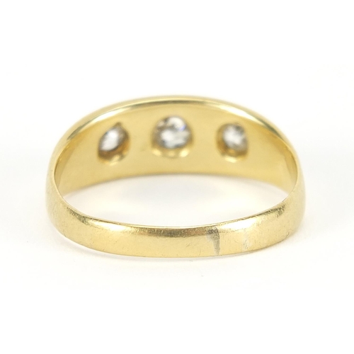 1 - 18ct gold diamond three stone Gypsy ring, the center diamond approximately 3.5mm in diameter, size U... 
