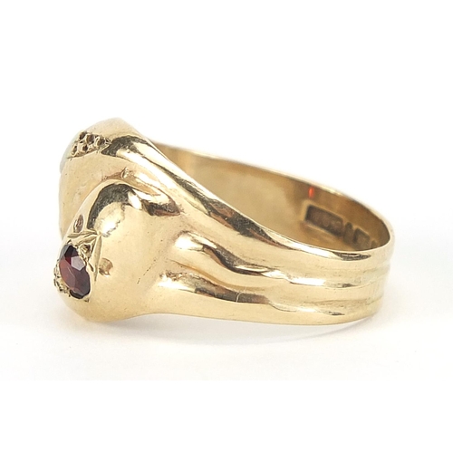 195 - 9ct gold serpent ring set with a garnet and opal, size Q, 4.2g