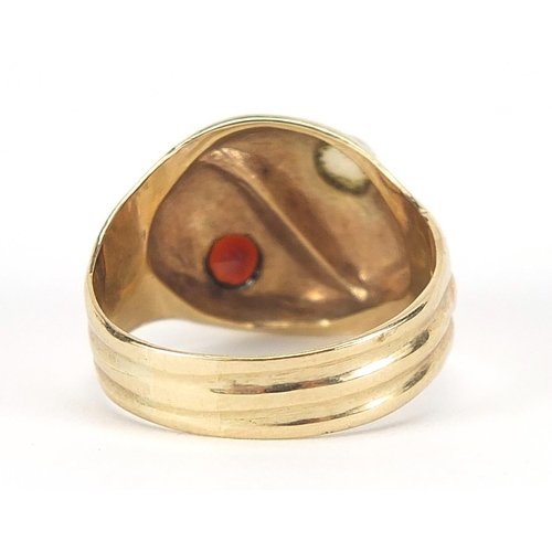 195 - 9ct gold serpent ring set with a garnet and opal, size Q, 4.2g