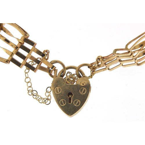 434 - 9ct gold five row gate bracelet with love heart padlock, 16cm in length, 6.6g