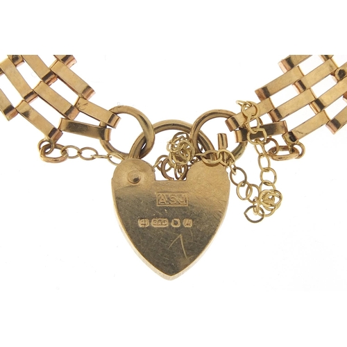 434 - 9ct gold five row gate bracelet with love heart padlock, 16cm in length, 6.6g